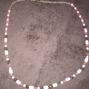 A stretchy pink and flower necklace